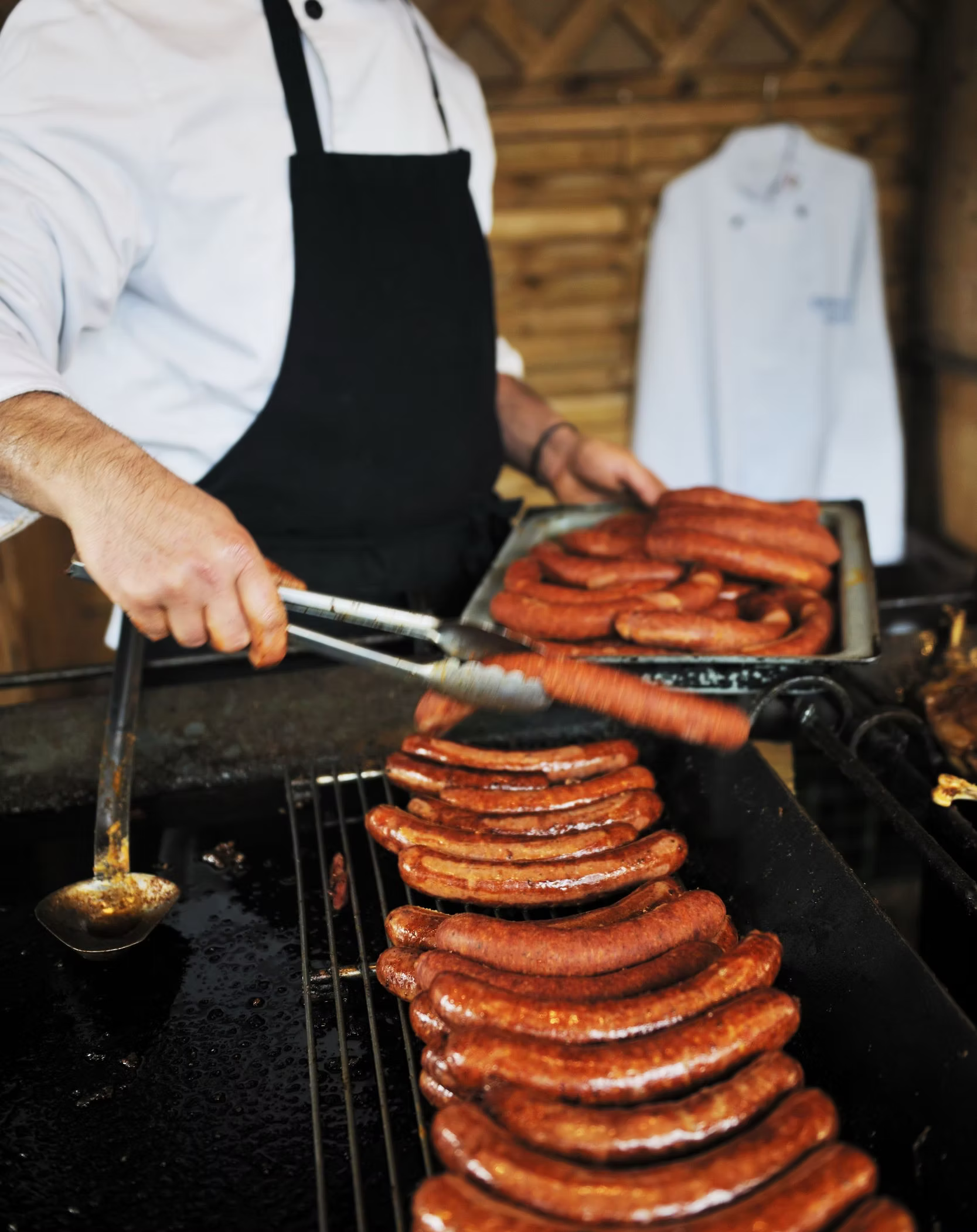 Man Grilling Sausages Man Grilling Sausages